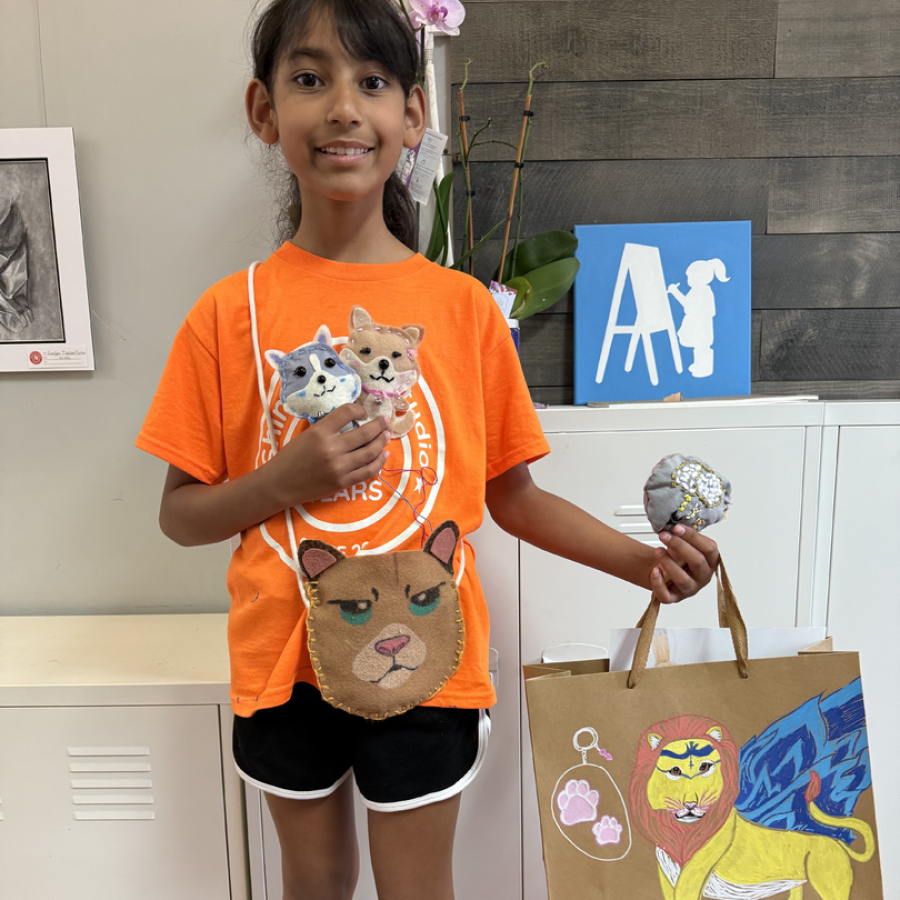 A camper with her hand stitched projects.